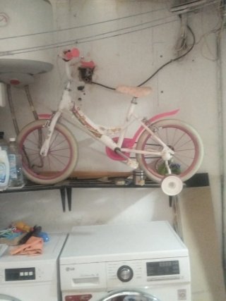 Bicicleta infantil rosa y blanca