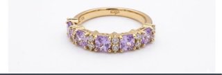 Anillo con piedras moradas y blancas
