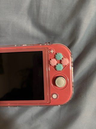 Nintendo Switch Lite Rosa con Funda Blanca