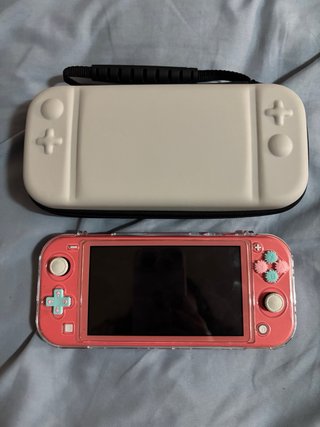 Nintendo Switch Lite Rosa con Funda Blanca