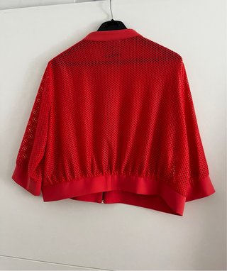 Chaqueta calada de red firma de Diseño