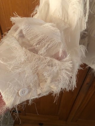 Blusa blanca con flecos