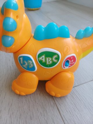 Juguete dinosaurio interactivo naranja
