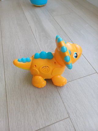 Juguete dinosaurio interactivo naranja