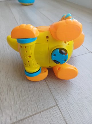 Juguete dinosaurio interactivo naranja