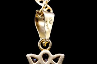 Cruz oro 18k con circonitas y esmeralda