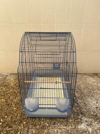 Jaula para pájaros negra y azul