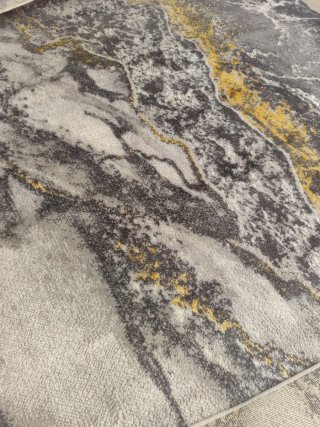 Alfombra efecto mármol gris y dorado