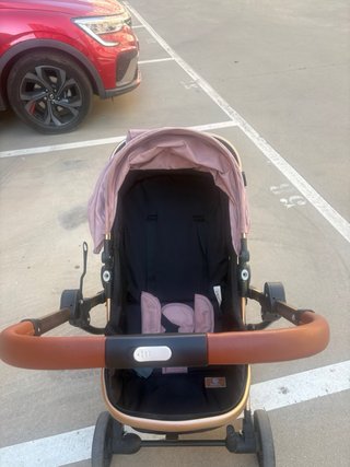 Carrito de bebé rosa y marrón