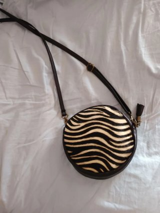 Bolso redondo cebra