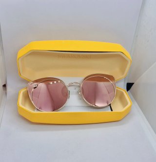 Gafas de sol Swarovski doradas y rosas