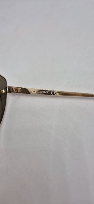 Gafas de sol Swarovski doradas y rosas