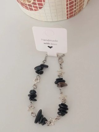 Pulsera minerales negros y estrellas plateadas