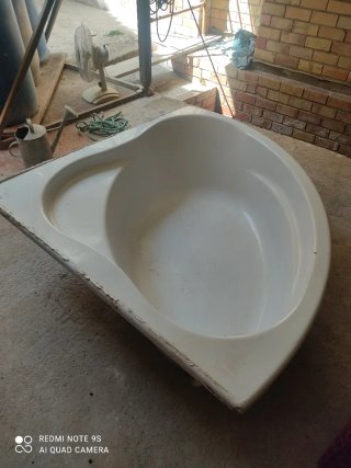 Bañera esquinera.