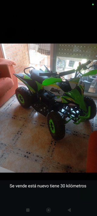 Quad infantil verde y negro precio negociable