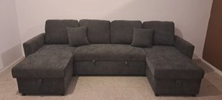 Sofá cama gris con doble arcón