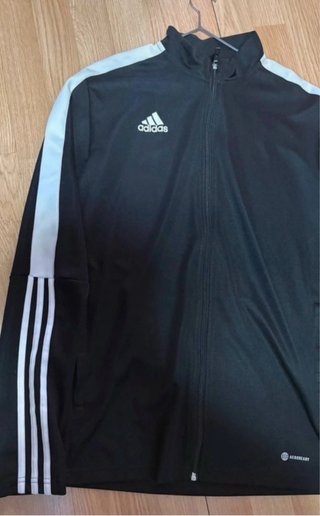 Chaqueta deportiva Adidas negra y blanca