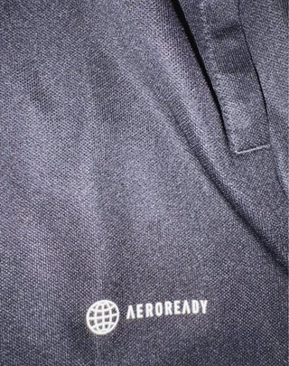 Chaqueta deportiva Adidas negra y blanca