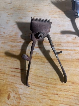 Máquina de cortar pelo antigua