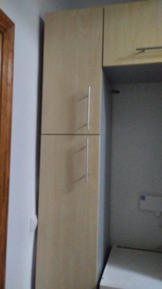 Muebles de cocina con vitrocerámica y osmosis