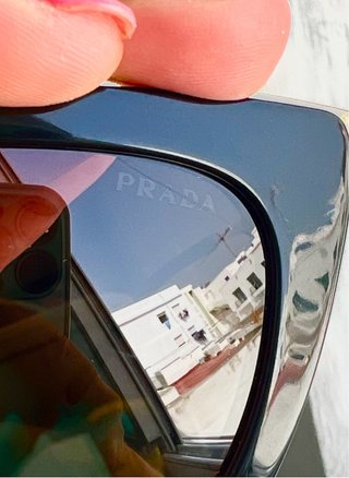 Gafas de sol Prada SPR53S negras y doradas