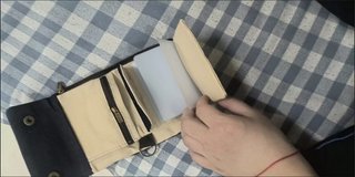 Cartera de lona negra y marrón