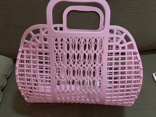 Cesta de plástico rosa plegable