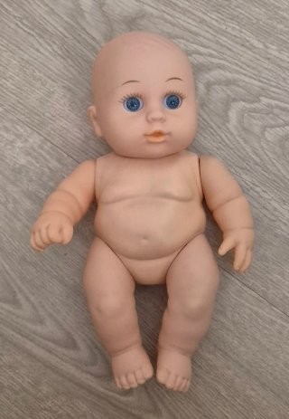 Muñeca bebé peluche rosa con orejas