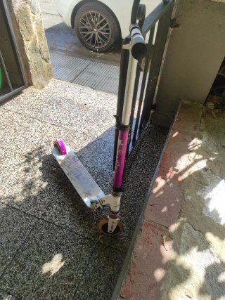 Patinete freestyle morado y plateado