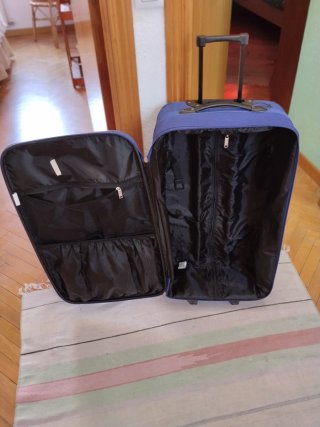Maleta de viaje con ruedas azul