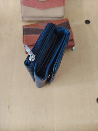 Monederos Piel Sintética precio por unidad.