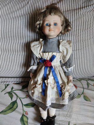 Muñeca porcelana vintage ojos azules