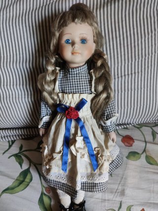 Muñeca porcelana vintage ojos azules
