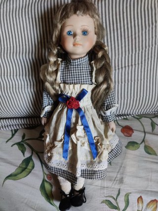 Muñeca porcelana vintage ojos azules