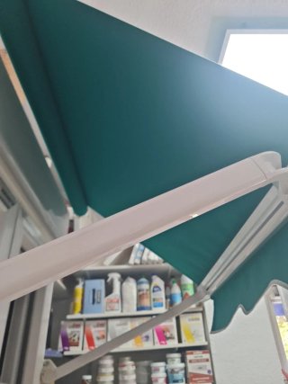 Toldo verde 1.10m con brazo 0.60m nuevo