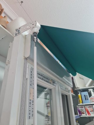 Toldo verde 1.10m con brazo 0.60m nuevo