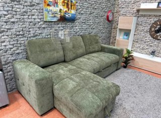 Sofá cama verde con arcón
