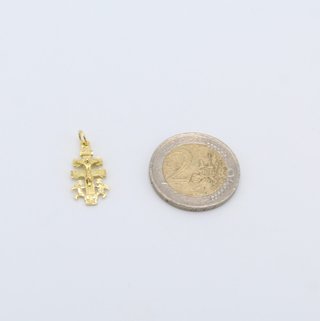 Cruz de oro de 18k. Peso: 1.36 gr.