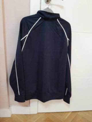 Giubbotto sportivo blu con dettagli bianchi