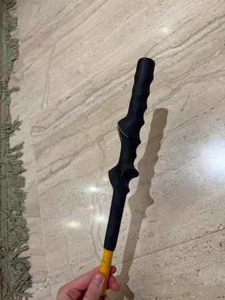 Palo de golf amarillo
