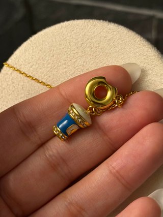 Collana Kate Spade con ciondoli