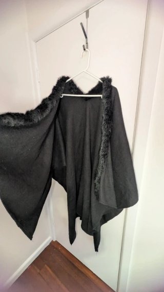 Fur lined neck, cape drape jacket.