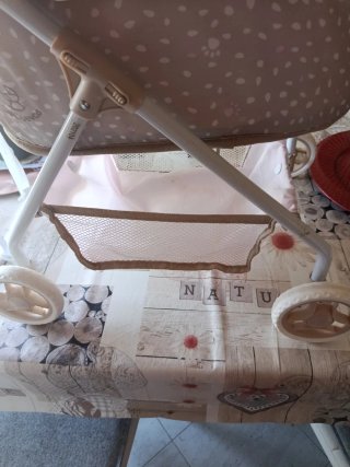 Carrito de muñecas rosa
