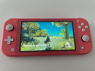 Nintendo Switch Lite Coral con juegos