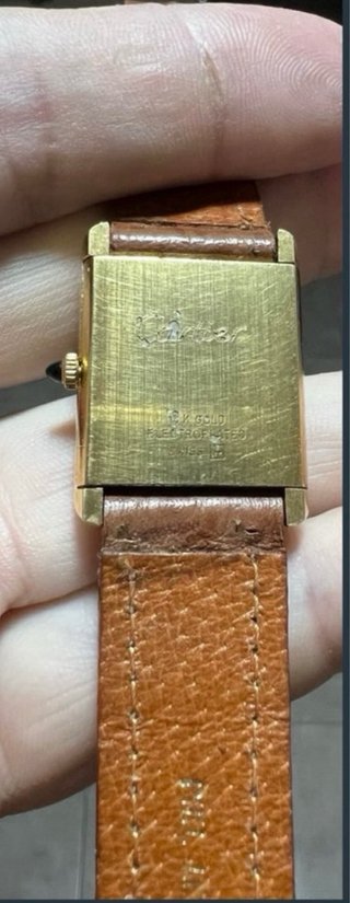 Must de Cartier Tank Reloj Negro y Dorado