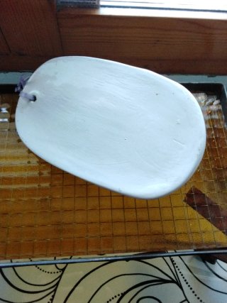 Pezzo in ceramica vintage con volto di donna