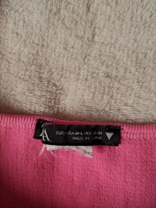 Top rosa canalé tirantes anchos