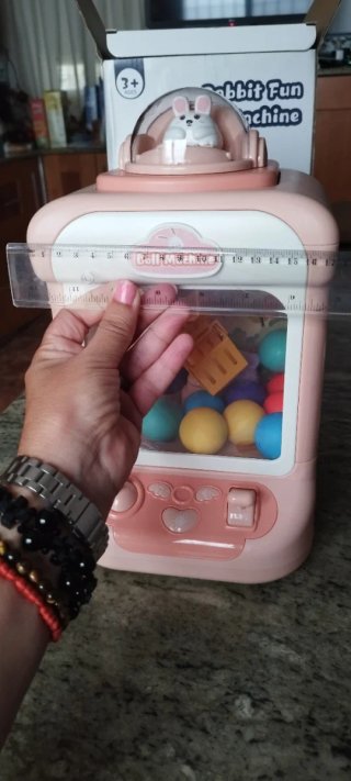 Máquina de gancho de juguete rosa