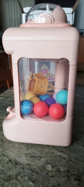 Máquina de gancho de juguete rosa