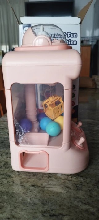 Máquina de gancho de juguete rosa